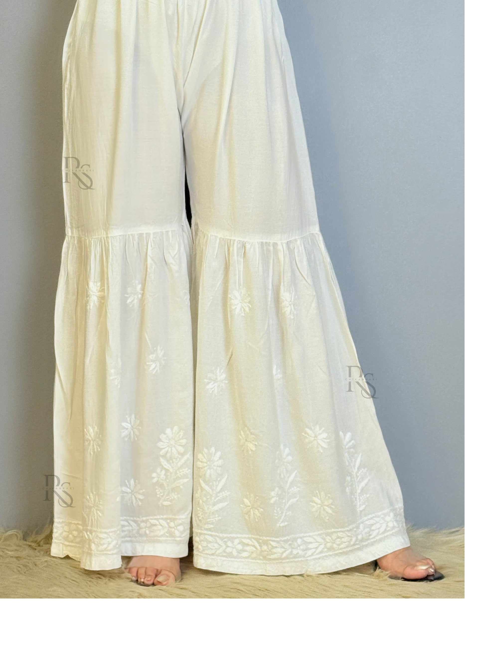 White modal chikankari sharara with flared hem and floral embroidery