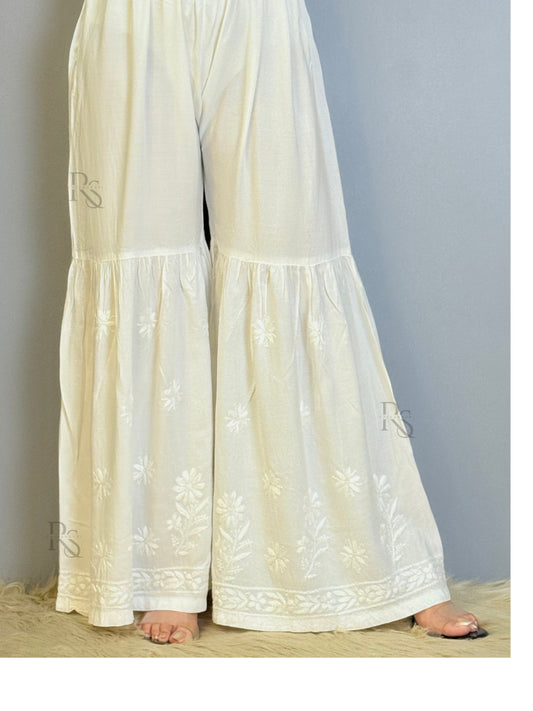 White modal chikankari sharara with flared hem and floral embroidery