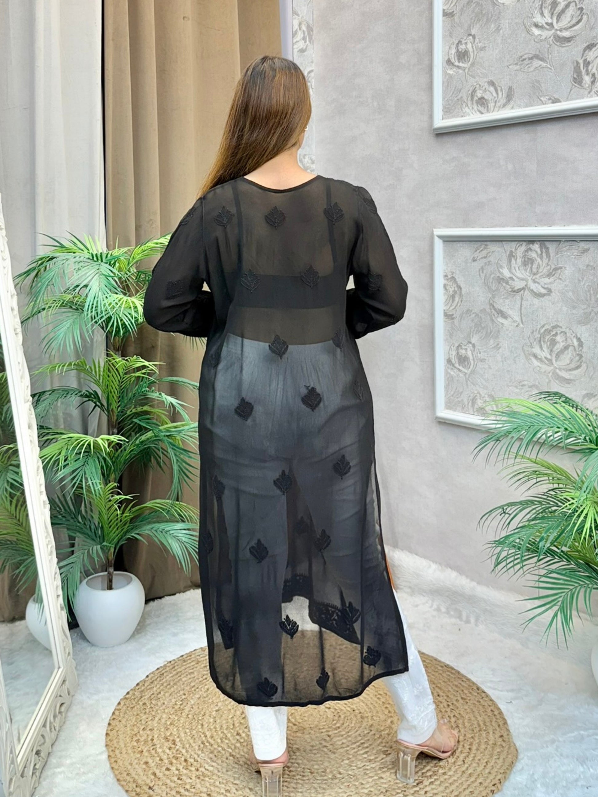 Woman wearing charcoal black chikankari kurta with tonal embroidery and V-neck design