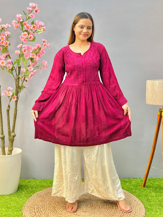 Woman wearing a premium wine red viscose Lucknowi Chikankari short frock with full sleeves and gathered waist, by R S CHIKANKARI.