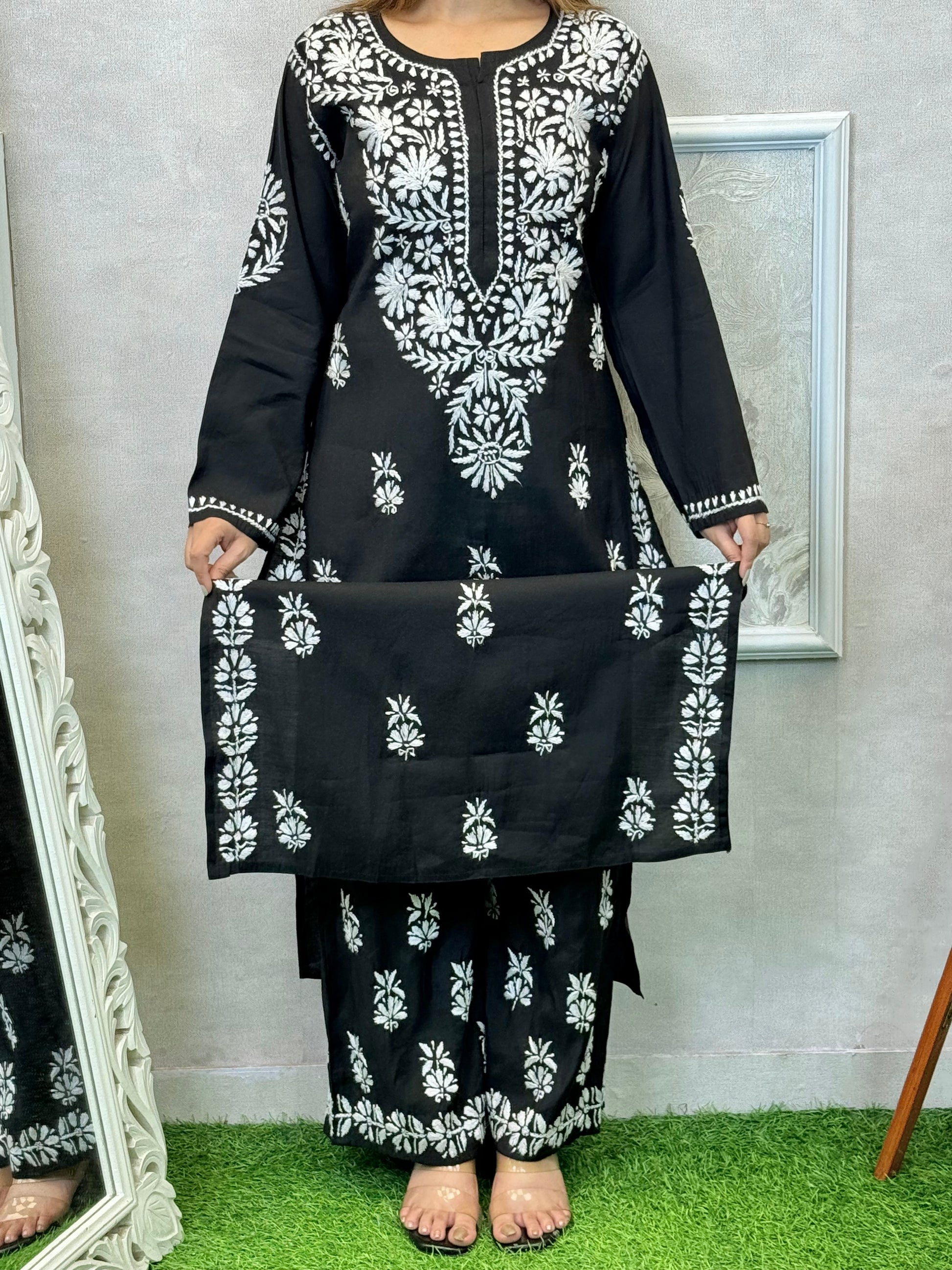 Black Roman silk Lucknow Chikankari kurta and palazzo set with white hand embroidery.