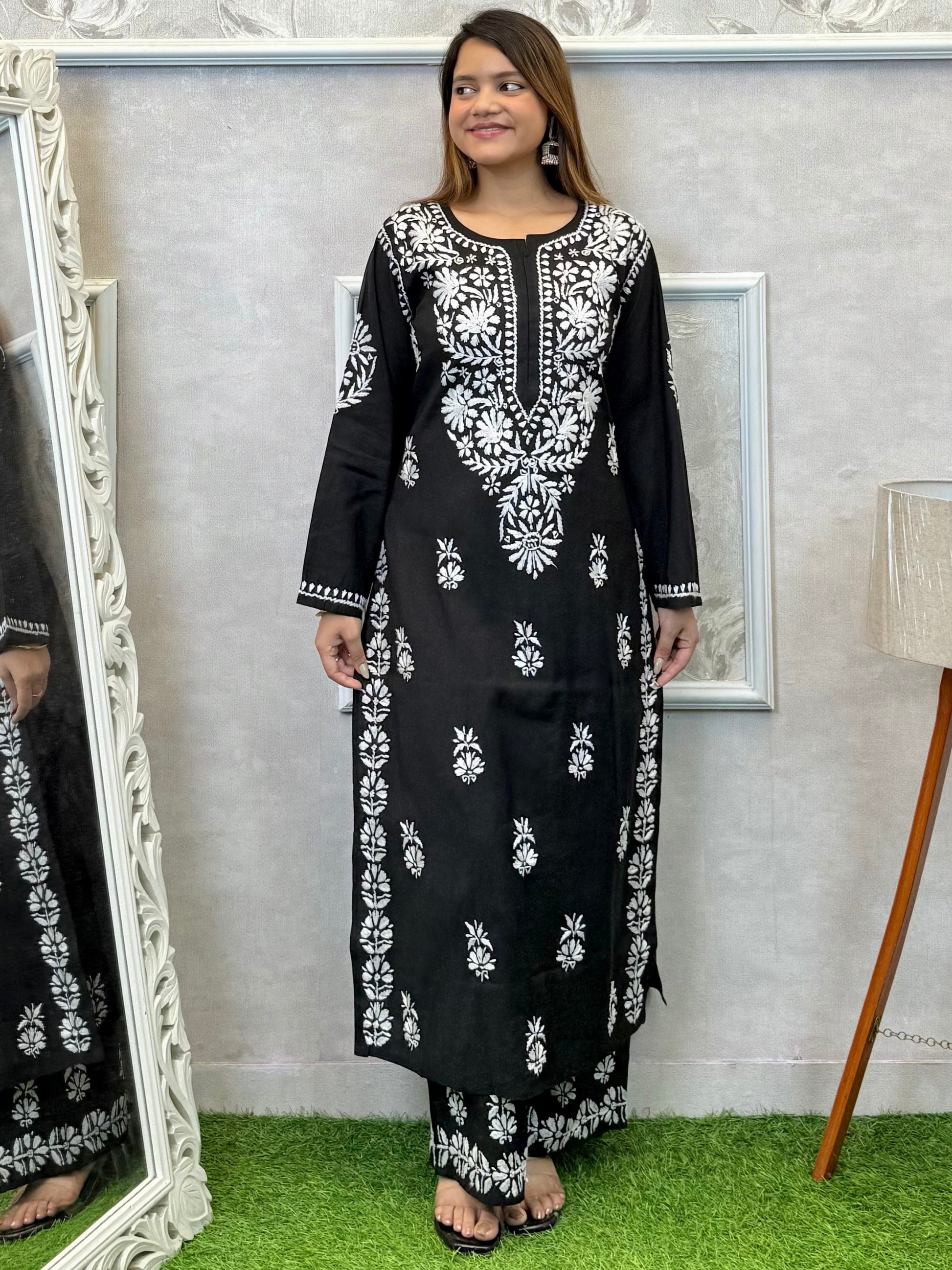 Black Roman silk Lucknow Chikankari kurta and palazzo set with white hand embroidery.
