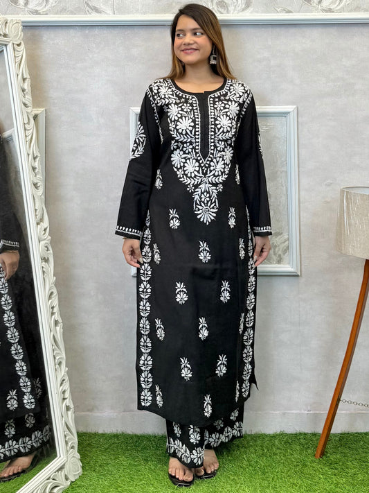 Black Roman silk Lucknow Chikankari kurta and palazzo set with white hand embroidery.
