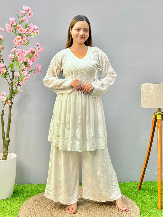 Woman wearing a premium white dyable viscose Lucknowi Chikankari short angrakha frock with full sleeves and tie-up detail, by R S CHIKANKARI.