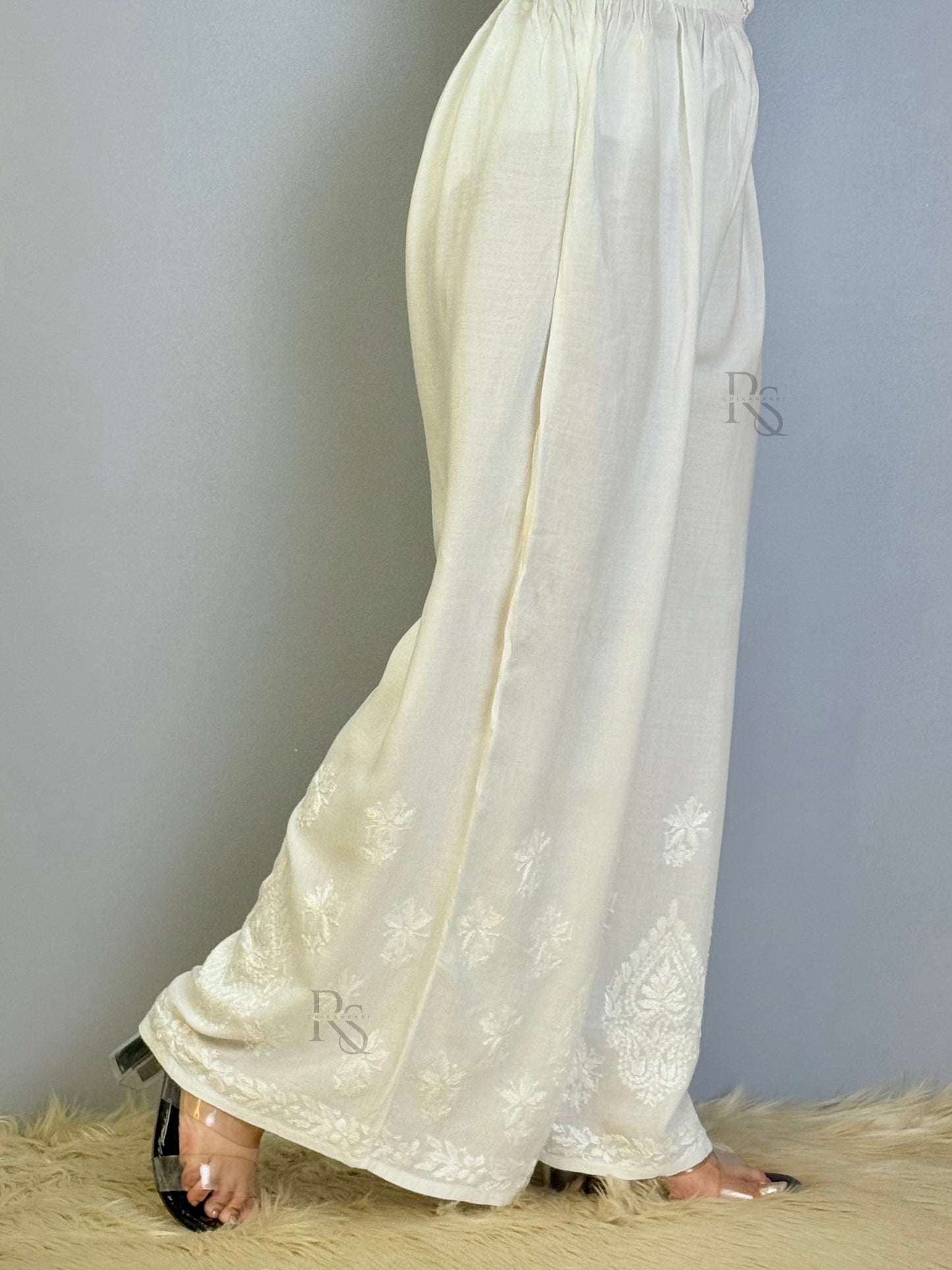 White rayon chikankari palazzo with wide-leg design and hem embroidery