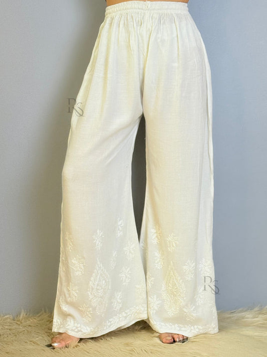 White rayon chikankari palazzo with wide-leg design and hem embroidery