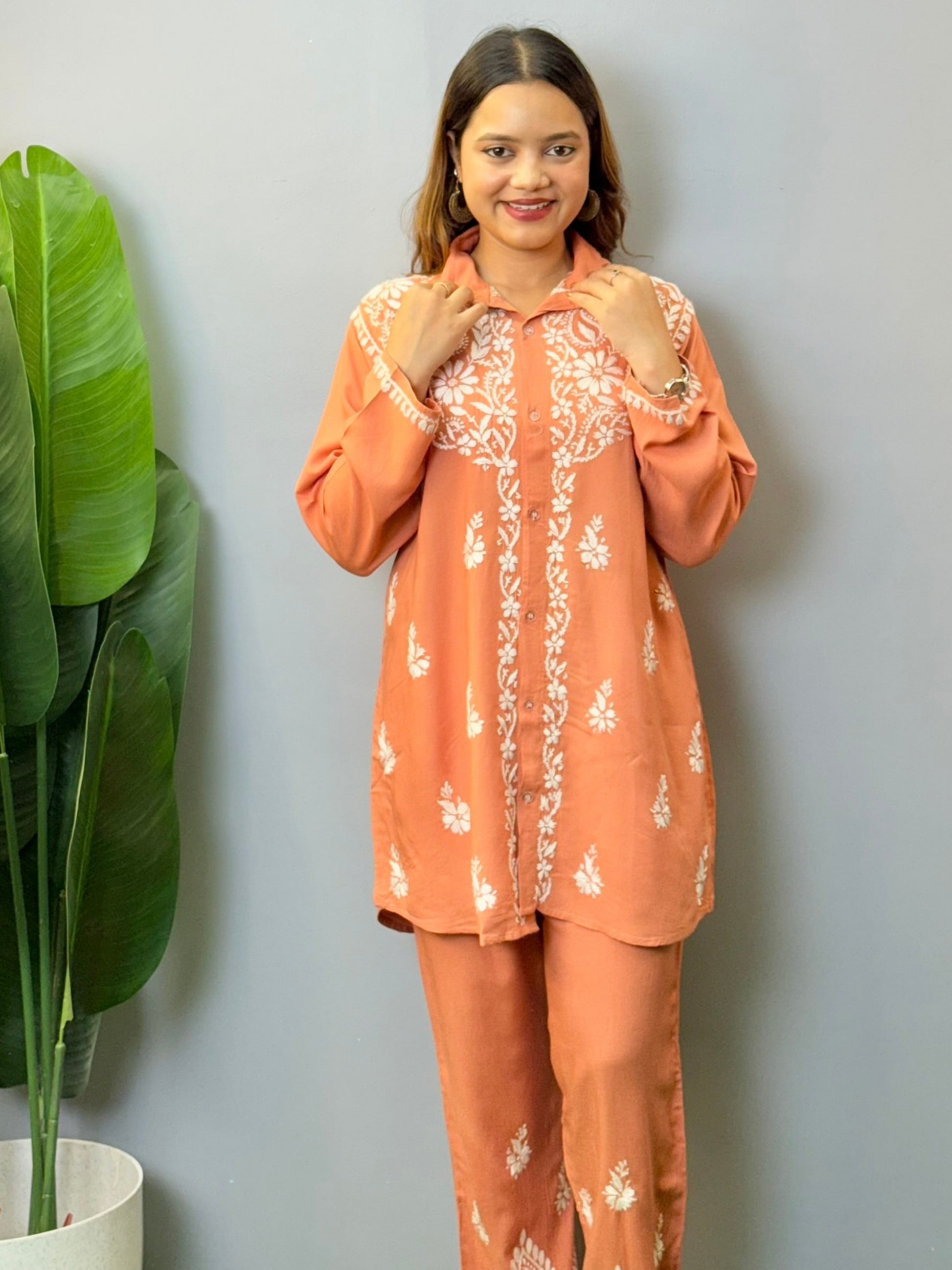 Terracotta Lucknowi chikankari short kurta and pant set in rayon fabric with white hand embroidery
