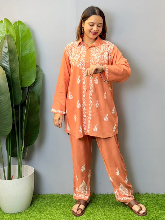 Terracotta Lucknowi chikankari short kurta and pant set in rayon fabric with white hand embroidery