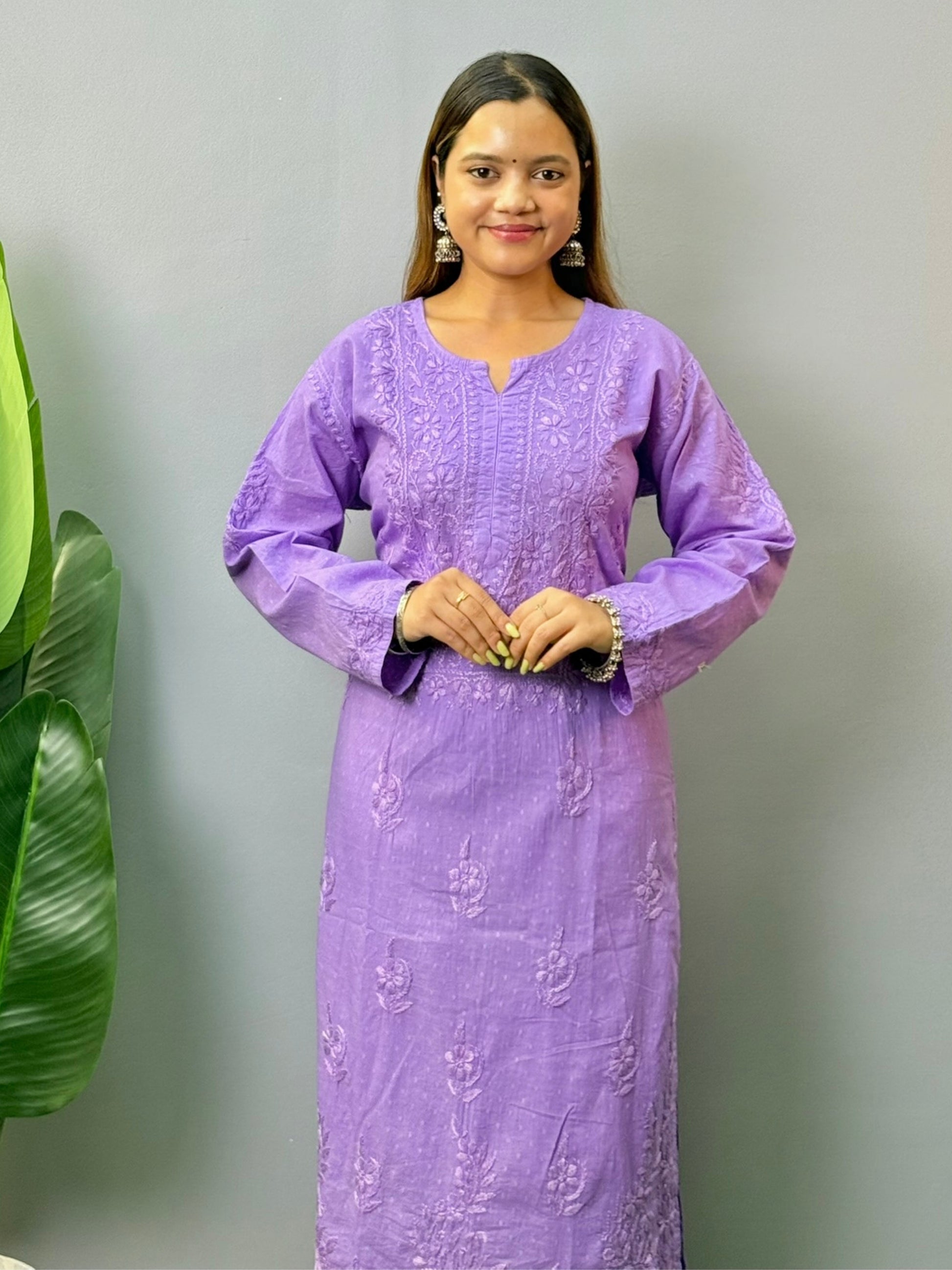 Model wearing lavender dobby cotton chikankari kurta and pant set