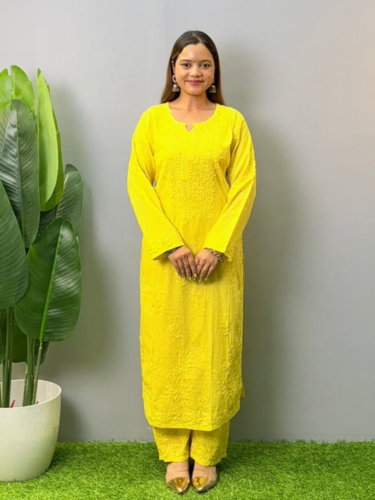Model wearing bright yellow dobby cotton chikankari kurta and pant set