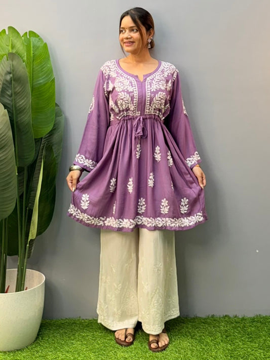 Woman wearing lavender flair short kurta with white Chikankari embroidery on modal fabric