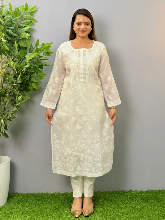 Model wearing a white voile cotton chikankari kurta with intricate hand embroidery