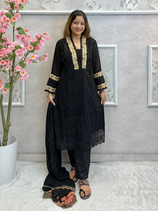 Black georgette kurta with gold zari embroidery, paired with cotton stretch pants and georgette dupatta
