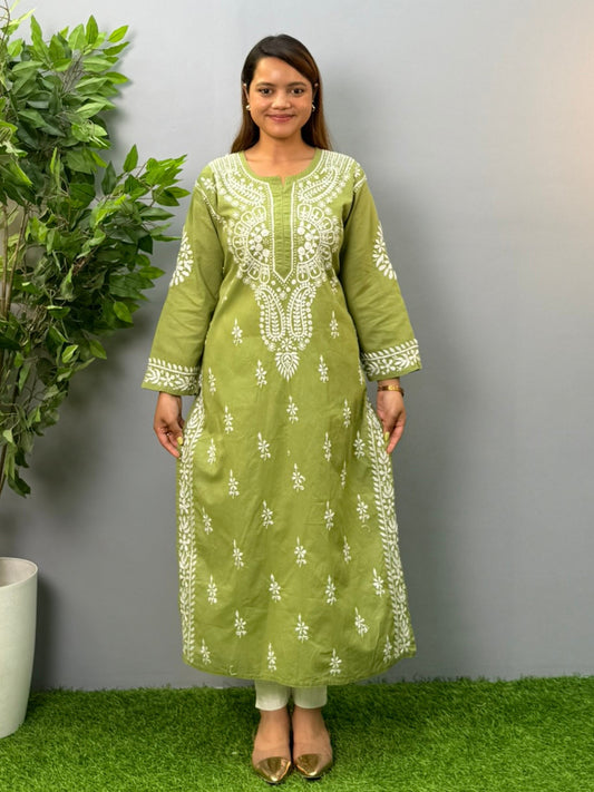 Model wearing an olive green cotton chikankari kurta with intricate white embroidery