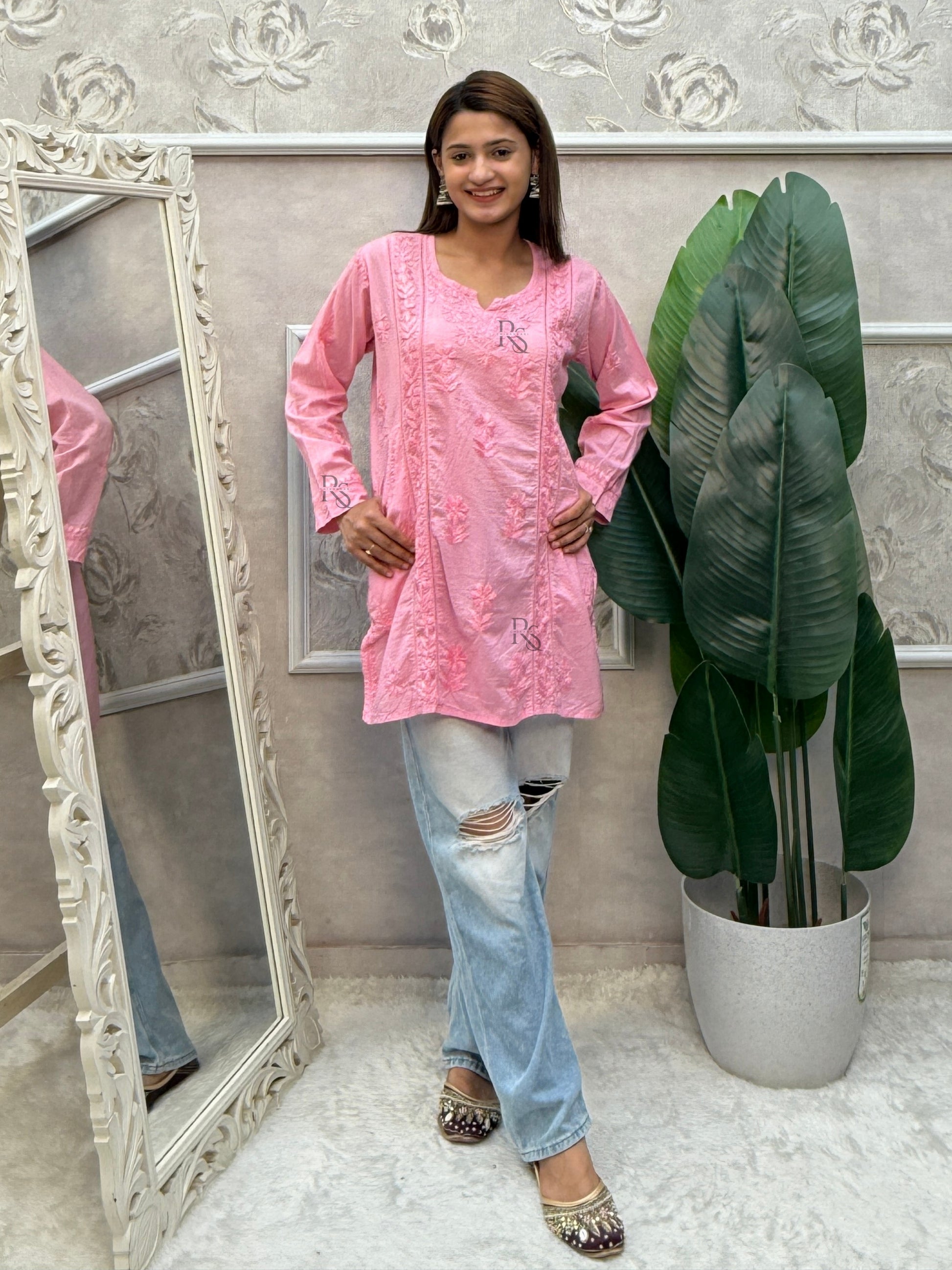 Pink cotton chikankari short kurta with hand embroidery and pockets.